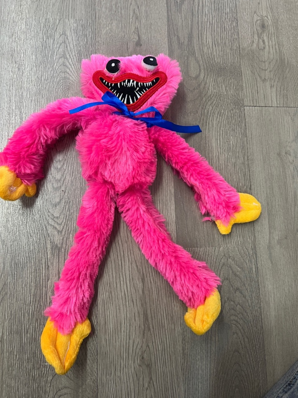 Plush Pink Fuzzy Monster Toy with Yellow Hands and Feet